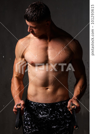 A guy in a great sports uniform in the studio on a gray background. A guy in a great sports uniform in the studio on a gray background. 101293615