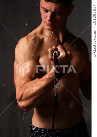 A guy in a great sports uniform in the studio on a gray background. A guy in a great sports uniform in the studio on a gray background. 101293617