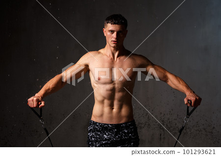 A guy in a great sports uniform in the studio on a gray background. 101293621