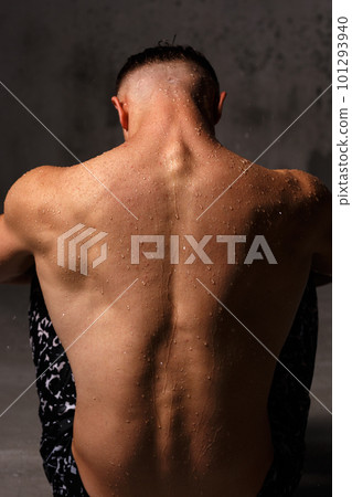 A guy in a great sports uniform in the studio on a gray background. A guy in a great sports uniform in the studio on a gray background. 101293940