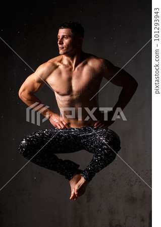 A guy in a great sports uniform in the studio on a gray background. A guy in a great sports uniform in the studio on a gray background. 101293943