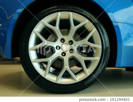 Ultralight alloy wheel mounted on a sports car closeup stock photo  101294801