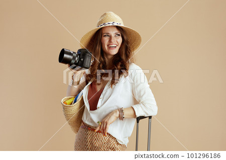 happy stylish woman in blouse and shorts isolated on beige 101296186