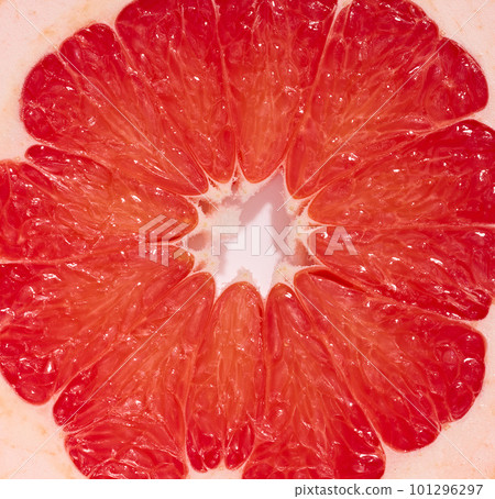 Round piece of grapefruit on a white isolated background, top view 101296297