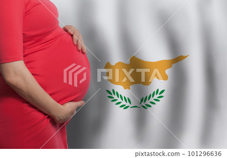 Close up pregnant woman belly on flag of Republic of Cyprus background Close up pregnant woman belly on flag of Republic of Cyprus background 101296636
