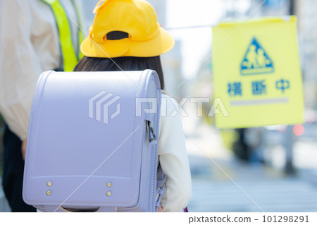 Elementary school girl walking on the school road Elementary school girl walking on the school road 101298291