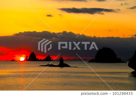 sun setting over the island sun setting over the island 101298433