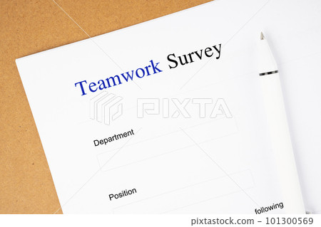 The Template of an Teamwork survey form document and and pen on wooden background. The Template of an Teamwork survey form document and and pen on wooden background. 101300569