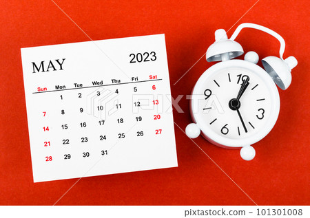 The May 2023 Monthly calendar year with alarm clock on red background. The May 2023 Monthly calendar year with alarm clock on red background. 101301008