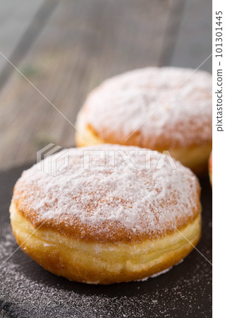 Ruddy donuts berliners on a stone board 101301445