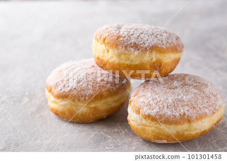 donuts berliners with filling sprinkled with powdered sugar 101301458