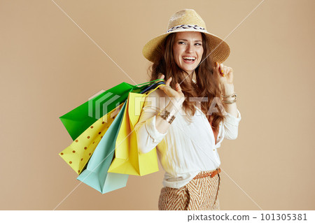 happy housewife in blouse and shorts isolated on beige happy housewife in blouse and shorts isolated on beige 101305381
