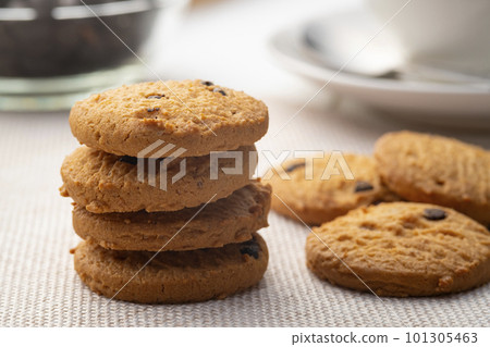 Heap of Chocolate chip cookies on wooden table Heap of Chocolate chip cookies on wooden table 101305463