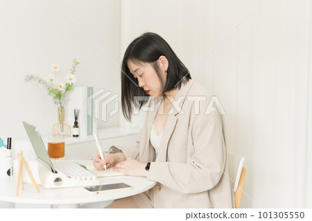 asian business and writer woman writing new her idea on book asian business and writer woman writing new her idea on book 101305550