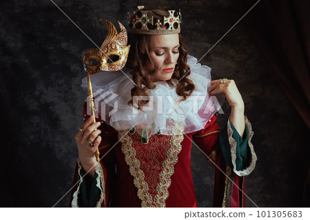 medieval queen in red dress with venetian mask 101305683