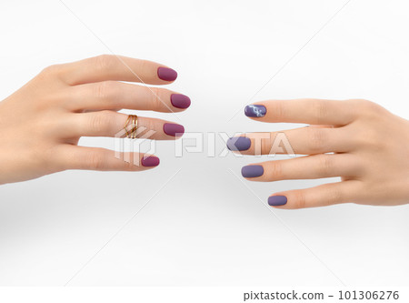 Beautiful purple burgundy matte manicure on white background Beautiful purple burgundy matte manicure on white background 101306276