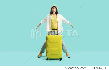 Smiling woman with suitcase excited with summer vacation 101306751