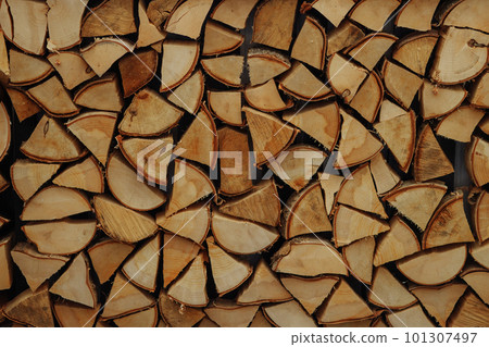 Woodpile, Chopped and stacked firewood, background. Woodpile, Chopped and stacked firewood, background. 101307497
