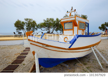 The traditional Greek motor boat is on a beach, Santorini island, Greece 101307920