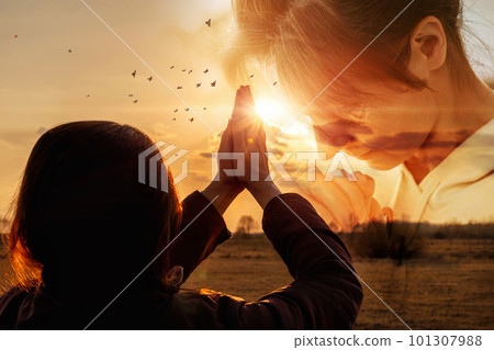 Concept of prayer and hope for peace and a peaceful sky. 101307988