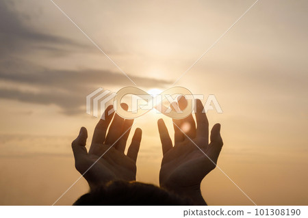 Hands support the sign of infinity . 101308190
