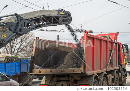 Loading heavy dump truck with crushed asphalt 101308334
