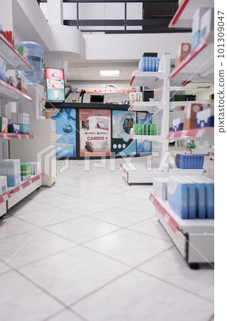 Empty health care facility with medicaments containers and supplements packages, retail shop shelves with pharmaceutical products. Pharmacy space filled with medical supplement and pills bottles. 101309047
