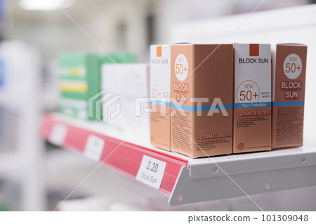 Selective focus of pharmacy shelves full with spf products and pharmaceuticals pills boxes to sell prescription medicine or treatment to clients. Empty drugstore filled with vitamins and drugs 101309048