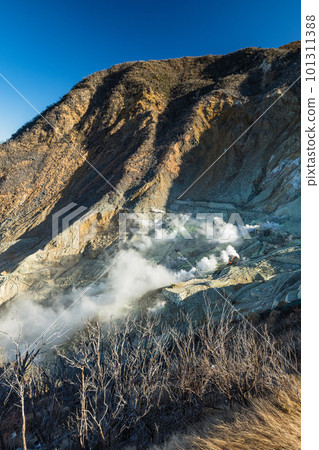 White fumaroles erupting from the rock face of Owakudani and Mt. 101311388