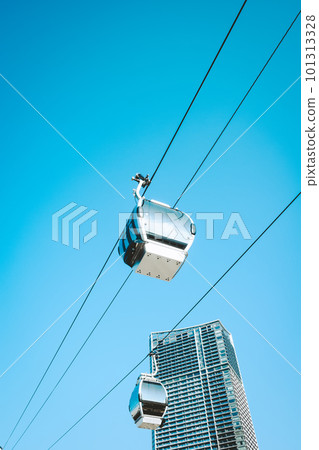Urban landscape with ropeway running under the blue sky c-5 film style 101313328