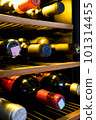 Wine cellar wine bottles lined up 101314455