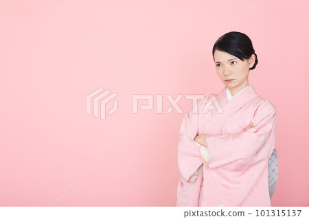 A woman in a kimono with her arms crossed A woman in a kimono with her arms crossed 101315137