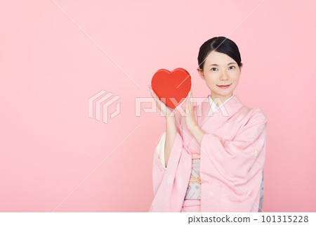 A woman in a kimono with a heart symbol A woman in a kimono with a heart symbol 101315228