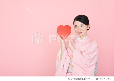 A woman in a kimono with a heart symbol A woman in a kimono with a heart symbol 101315230