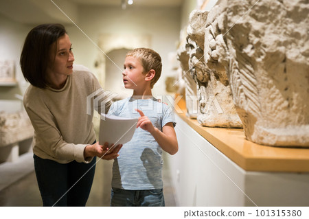 Woman and boy visiting sculptures exhibition Woman and boy visiting sculptures exhibition 101315380