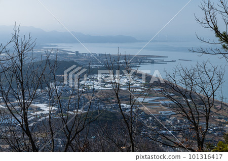 The Seto Inland Sea and cityscape seen from the approach to the sky torii of Takaya Shrine on the top of Mt. Inazumi in Kanonji City, Kagawa Prefecture, Japan 101316417