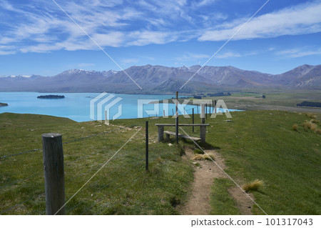 Fences and steps dividing Lake Tekapo and pastures 101317043