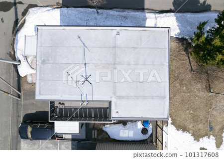 Aerial view of the roof before replacement (before and after housing renovation) 101317608