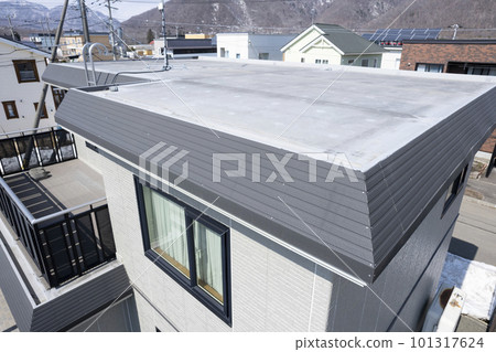 Aerial view of dented eaves due to snow damage (before and after housing renovation) 101317624