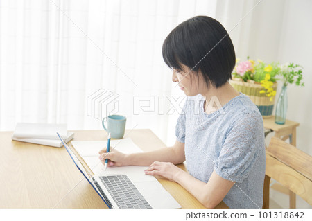 Woman studying with a laptop at home Woman studying with a laptop at home 101318842