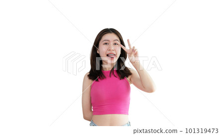 Young Asian woman making two thumbs up gesture showing joy and fun, Symbol of good friendship, Popular photo poses, Make a v-shaped finger, Yellow background. Young Asian woman making two thumbs up gesture showing joy and fun, Symbol of good friendship, Popular photo poses, Make a v-shaped finger, Yellow background. 101319473