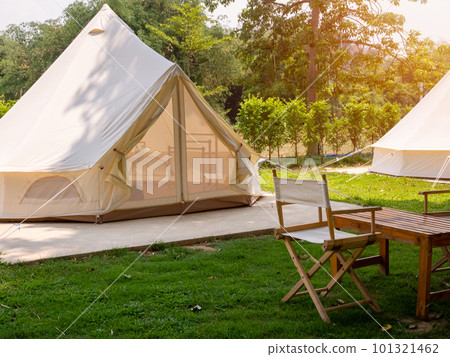 Camping picnic tent campground in outdoor hiking forest. Camper while campsite in nature background at summer trip camp. Adventure Travel Vacation concept Camping picnic tent campground in outdoor hiking forest. Camper while campsite in nature background at summer trip camp. Adventure Travel Vacation concept 101321462