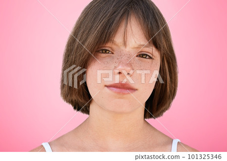Close up portrait of freckled stylish small kid looks with narrow dark eyes directly into camera, has serious expression, isolated over pink studio background. Children, beauty, lifestyle concept Close up portrait of freckled stylish small kid looks with narrow dark eyes directly into camera, has serious expression, isolated over pink studio background. Children, beauty, lifestyle concept 101325346