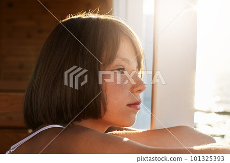 Freckled child with bobbed hairdo, looking into distanse, admiring beautiful sea landscapes, dreaming about something. Little girl spending summer vacations at sea with her parents, travelling on boat Freckled child with bobbed hairdo, looking into distanse, admiring beautiful sea landscapes, dreaming about something. Little girl spending summer vacations at sea with her parents, travelling on boat 101325393