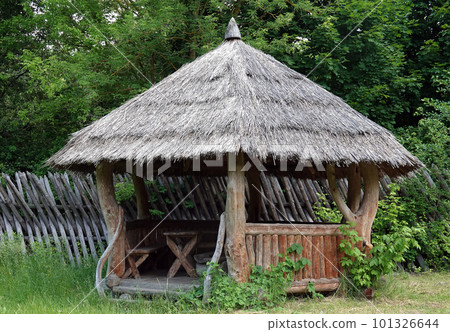Kiev, Ukraine June 19, 2021: Old wooden gazebo entertainment complex Kievan Rus 101326644