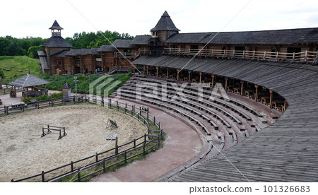 Kiev, Ukraine June 19, 2021: old wooden fortress - entertainment complex Kievan Rus old wooden fortress and artists doing a performance. Kiev, Ukraine June 19, 2021: old wooden fortress - entertainment complex Kievan Rus old wooden fortress and artists doing a performance. 101326683