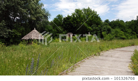 Kiev, Ukraine June 19, 2021: Old wooden gazebo entertainment complex Kievan Rus Kiev, Ukraine June 19, 2021: Old wooden gazebo entertainment complex Kievan Rus 101326708