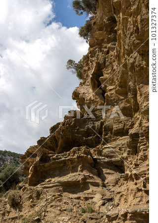 Rock wall on the beach, Limenas, Greece 101327374