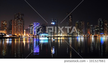 Sharjah, UAE February 24, 2020: at night city buildings and avenues of the city of Sharjah Sharjah, UAE February 24, 2020: at night city buildings and avenues of the city of Sharjah 101327661