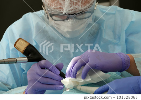 Kiev, Ukraine August 22, 2020: Dentist doctor works with a patient close-up Kiev, Ukraine August 22, 2020: Dentist doctor works with a patient close-up 101328063